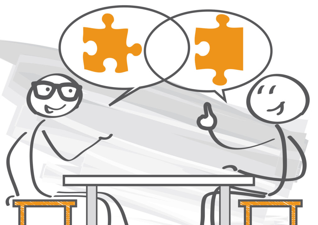 Zwei Strichmännchen im Gespräch mit Puzzleteilen als Symbol für gemeinsame Ideenentwicklung und Buchprojekte.